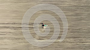 Top down view of tractor sowing in agriculture area